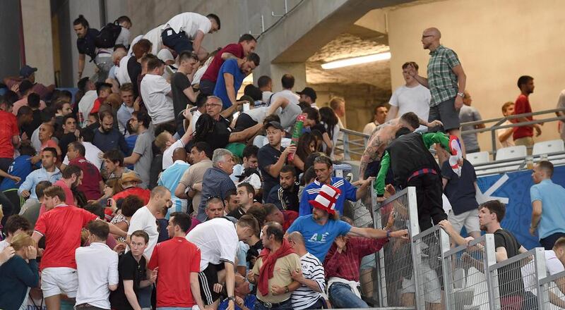 Supporters clash in the stands after the UEFA EURO 2016 group B preliminary round match between England and Russia at Stade Velodrome in Marseille, France. Daniel Dal Zennaro / EPA