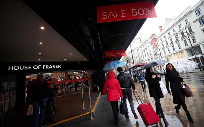 FILE PHOTO: Shoppers walk past House of Fraser on Oxford Street in central London, Britain, April 2, 2018. REUTERS/Hannah McKay//File Photo
