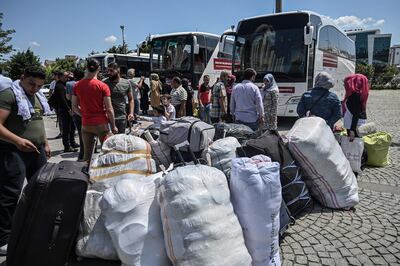 (FILES) In this file photo taken on August 06, 2019, Syrian refugee families wait with other volunteers to board buses returning to neighbouring Syria in the Esenyurt district of Istanbul.  Syria's conflict has displaced millions of people since 2011, and its neighbours have absorbed the majority of those fleeing abroad. But today, with no political solution to the conflict in sight, Turkey, Lebanon and Jordan -- who together host at least 5.2 million Syrian refugees -- are increasingly seeing that population as a "burden".
 / AFP / Ozan KOSE
