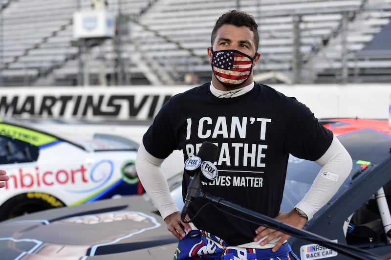 Bubba Wallace, driver of the #43 Richard Petty Motorsports Chevrolet, wears a "I Can't Breathe - Black Lives Matter" t-shirt under his fire suit in solidarity with protesters around the world, speaks to the media prior to the NASCAR Cup Series Blue-Emu Maximum Pain Relief 500 at Martinsville Speedway, Virginia.  Getty Images