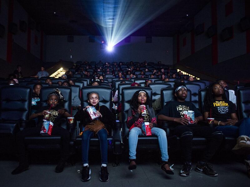 Mari Copeny, third from left, watches a free screening of the film "Black Panther" with more than 150 children, after she raised $16,000 to provide free tickets in Flint Township, Mich. Just as “Black Panther” is setting records at the box office, a new study finds that diverse audiences are driving most of the biggest blockbusters and many of the most-watched hits on television. AP