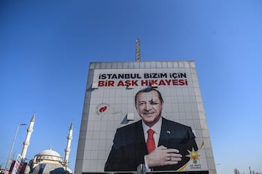 A poster of President Recep Tayyip Erdogan for the upcoming Turkish local elections hangs in Istanbul, reading "Istanbul is a love story for us". AFP