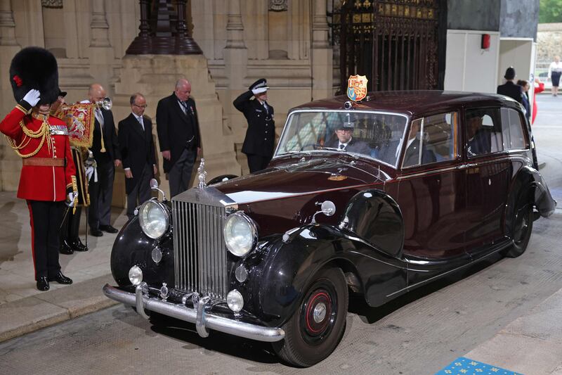 Prince Charles and Camilla arriving in a Rolls Royce at the Sovereign's Entrance. AFP