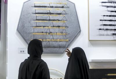 Dubai, United Arab Emirates - Visitors  looking at the artwork of artist Sara Alharbali called Tajrid at the World Art Dubai at Dubai World Trade Centre.  Leslie Pableo for The National for Razmig's story