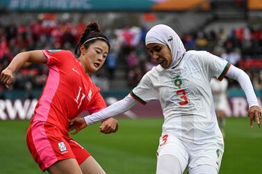 South Korea's forward #11 Choe Yu-Ri (L) and Morocco's defender #03 Nouhaila Benzina fight for the ball during the Australia and New Zealand 2023 Women's World Cup Group H football match between South Korea and Morocco at Hindmarsh Stadium in Adelaide on July 30, 2023.  (Photo by Brenton EDWARDS  /  AFP)