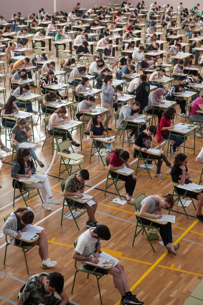 epa06786002 A general view of students during the entrance examination for the university at Josep Miquel Guardia High School's basketball court in Menorca, Balearic islands, Spain, 05 June 2018.  EPA/DAVID ARQUIMBAU