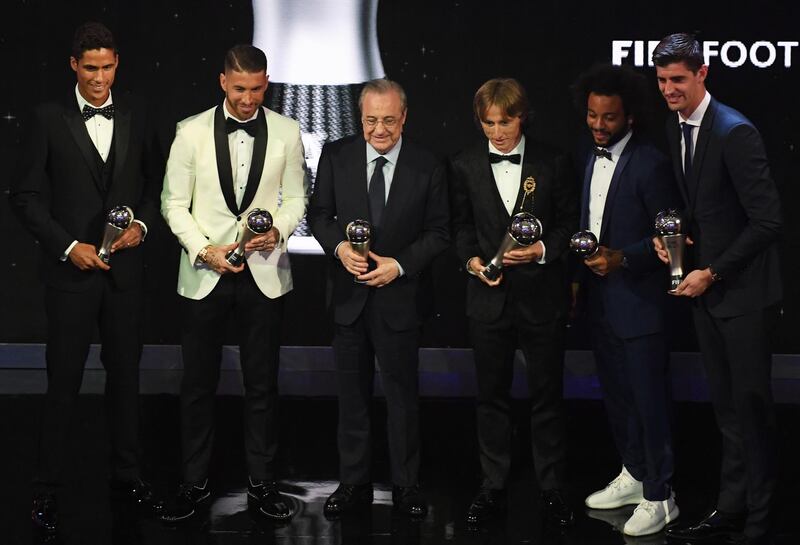 Left to right: Real Madrid's Raphael Varane, Sergio Ramos, club president Florentino Perez, Luka Modric, Marcelo and goalkeeper Thibaut Courtois pose with their awards during the Best FIFA Football Awards 2018 in London.  EPA