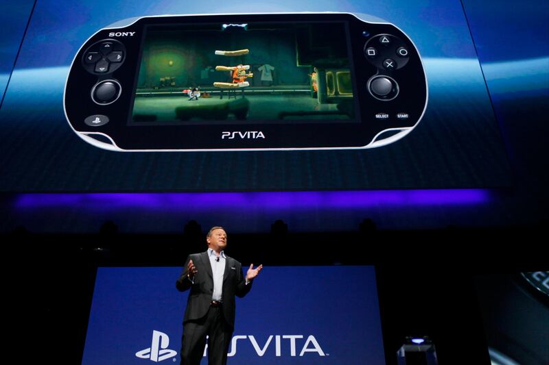 Jack Tretton, chief executive officer of Sony Computer Entertainment America Inc., talks about the company's PlayStation Vita handheld gaming console during the Sony Corp. E3 media event in Los Angeles, California, U.S., on Monday, June 10, 2013. Sony Corp. took the wraps off the PlayStation 4, its first new console in seven years, promising original content and fresh titles will revitalize demand and spark a comeback for the video-game industry it once dominated. Photographer: Patrick T. Fallon/Bloomberg *** Local Caption *** Jack Tretton 1237363.jpg