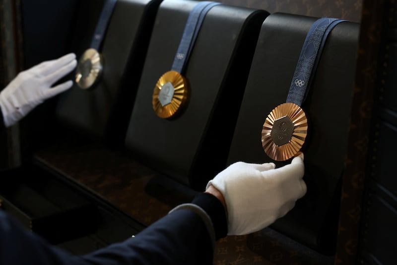Olympic gold, silver and bronze medals in a Louis Vuitton medals trunk, which will transport and protect the gongs. Reuters