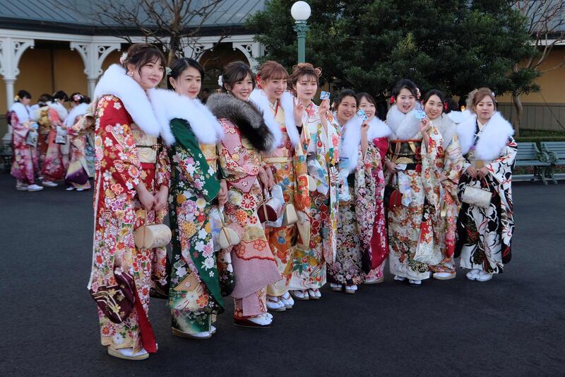 Twenty-year-old women draped in traditional kimonos gather for their 'Coming-of-Age Day' ceremony at the Tokyo Disneyland in Tokyo, Japan. AFP