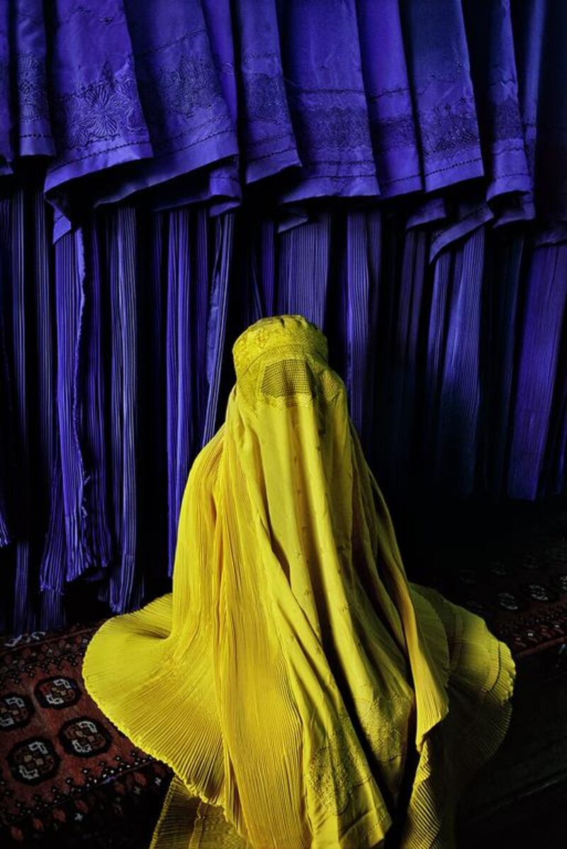 Woman in canary burqa, 2002. Copyright ©Steve McCurry / Magnum Photos
