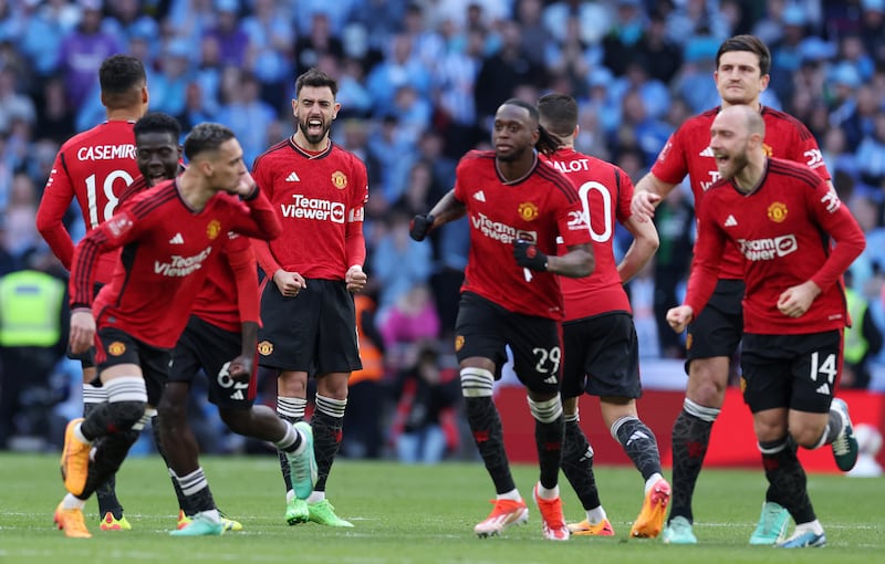 Manchester United players celebrate winning 4-2 on penalties after the FA Cup semi-final finished 3-3 after extra-time. EPA