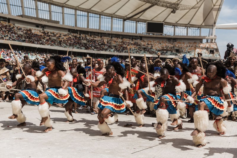 Men from Swaziland perform a dance to celebrate King Misuzulu Zulu's coronation at the Moses Mabhida Stadium in Durban. AFP