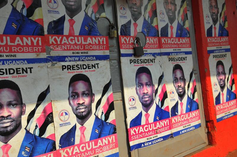 epa08934989 Election posters for presidential candidate Robert Kyagulanyi Ssentamu otherwise known as Bobi Wine adorn a locked store front in the capital Kampala a day ahead of the presidential elections in Uganda, 13 January 2021. The Ugandan presidential elections are due to take place on 14 January 2021, with Bobi Wine emerging as the top opposition challenger against incumbent Ugandan president Yoweri Kaguta Museveni, who has been President since 1986. President Yoweri Museveni has ordered the shutdown of some social media and messaging apps including Facebook ahead of the election.  EPA/STR