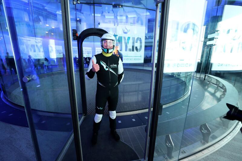 Abu Dhabi, United Arab Emirates - November 28th, 2019: An instructor puts on his safety gear. Athletes and famous skydivers as well as climbers will be the first who experience the world's biggest indoor skydiving flight chamber and the world's tallest indoor climbing wall on the opening ceremony of the ultimate indoor adventure venue, Clymb. Thursday, November 28th, 2019. Yas Mall, Abu Dhabi. Chris Whiteoak / The National