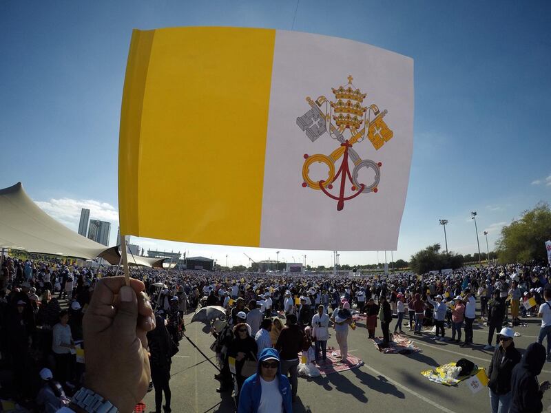 Holy flag and crowd outside the stadium. Pawan Signh / The National