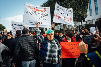 A cartoon depicting Amdouni in a rainbow clown wig and nose astride the minaret of Tunis's Zitouna Mosque was circulated widely on Facebook, including on police union pages and among far-right politicians. Erin Clare Brown / The National