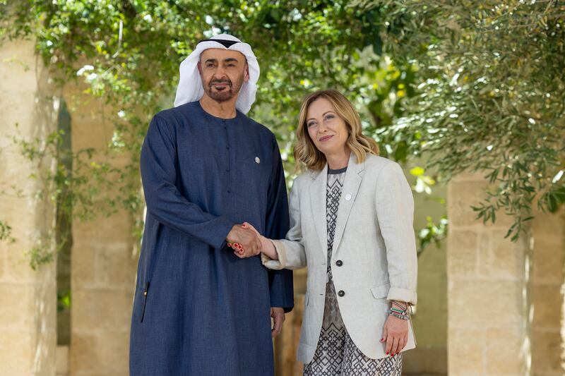 President Sheikh Mohamed is received by Prime Minister  Giorgia Meloni of Italy, after arriving at the summit venue, at Borgo Egnazia resort. Photo: Ryan Carter / UAE Presidential Court