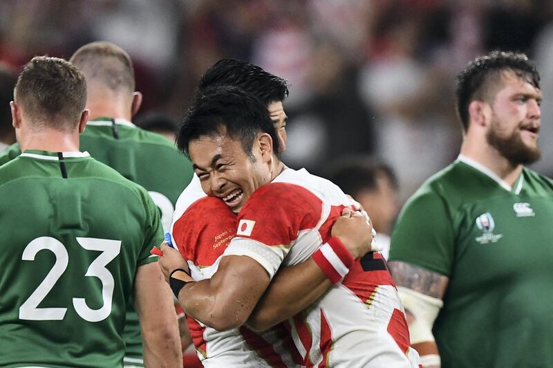 Japan's players celebrate after winning the Japan 2019 Rugby World Cup Pool A match between Japan and Ireland at the Shizuoka Stadium Ecopa in Shizuoka on September 28, 2019. (Photo by Anne-Christine POUJOULAT / AFP)