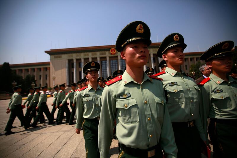 Chinese paramilitary officers march outside the Great Hall of the People after an event celebrating the 200th year anniversary of the birth of German philosopher Karl Marx in Beijing, China. Since coming to power in 2012, Xi, widely seen as the most powerful Chinese leader since Mao Zedong, has said the party must not forget its socialist roots as it works to attain the "great rejuvenation of the Chinese nation". How Hwee Young / EPA