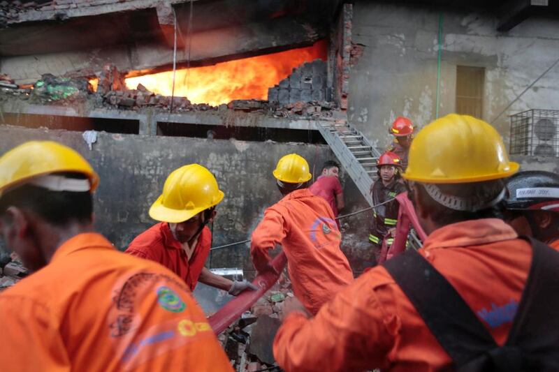 Firefighters work to put out the fire at a packaging factory in Tongi industy area outside Dhaka, Bangladesh. A M Ahad / AP Photo