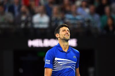 epa07311228 Novak Djokovic of Serbia reacts during his men's singles quarter final match against Kei Nishikori of Japan at the Australian Open Grand Slam tennis tournament in Melbourne, Australia, 23 January 2019.  EPA/LUKAS COCH AUSTRALIA AND NEW ZEALAND OUT