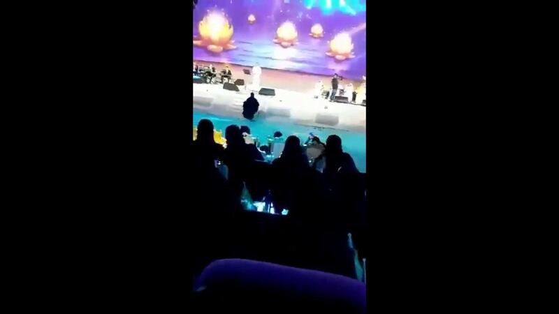 A screenshot of a the girl rushing the stage during Majed Al Muhandis' perfromance in Taif, Saudi Arabia. Twitter