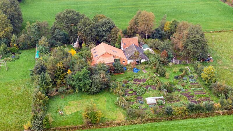 epa07922542 A drone photo of the farm, where a father and six children had been living in the cellar, In Ruinerwold, The Netherlands, 15 October 2019. The family lived in the cellar for years and where waiting for 'the end of time'.  EPA/Wilbert Bijzitter