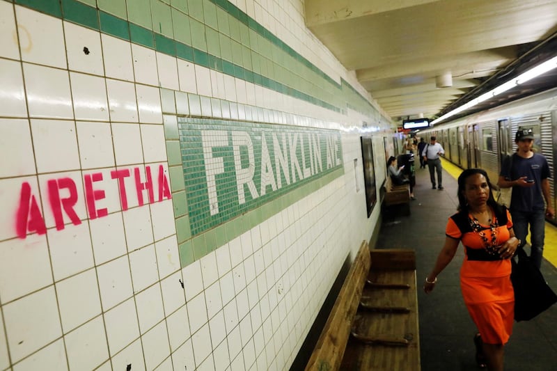 "Aretha" is spray painted next to a sign at the Franklin Street Subway Station. Reuters