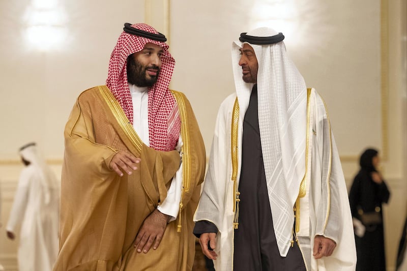 ABU DHABI, UNITED ARAB EMIRATES - November 22, 2018: HH Sheikh Mohamed bin Zayed Al Nahyan, Crown Prince of Abu Dhabi and Deputy Supreme Commander of the UAE Armed Forces (centre R), receives HRH Prince Mohamed bin Salman bin Abdulaziz, Crown Prince, Deputy Prime Minister and Minister of Defence of Saudi Arabia (centre L), during a reception at the Presidential Airport in Abu Dhabi. 
( Ryan Carter / Ministry of Presidential Affairs )
---
