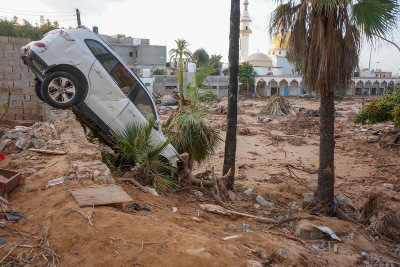 Vehicles are buried in mud and rubble in the aftermath of a devastating flood in Libya’s eastern coastal city of Derna. AFP