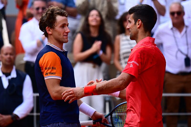 Novak Djokovic shakes hands with Casper Ruud after the match. AFP