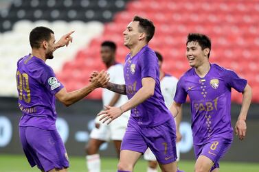 Al Ain forward Caio, centre, celebrates scoring. Chris Whiteoak / The National