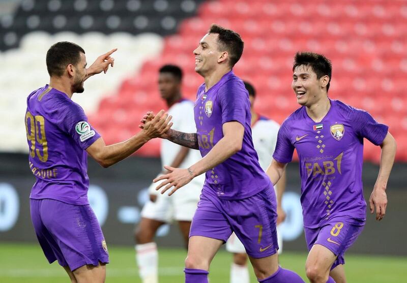 Al Ain forward Caio, centre, celebrates scoring. Chris Whiteoak / The National