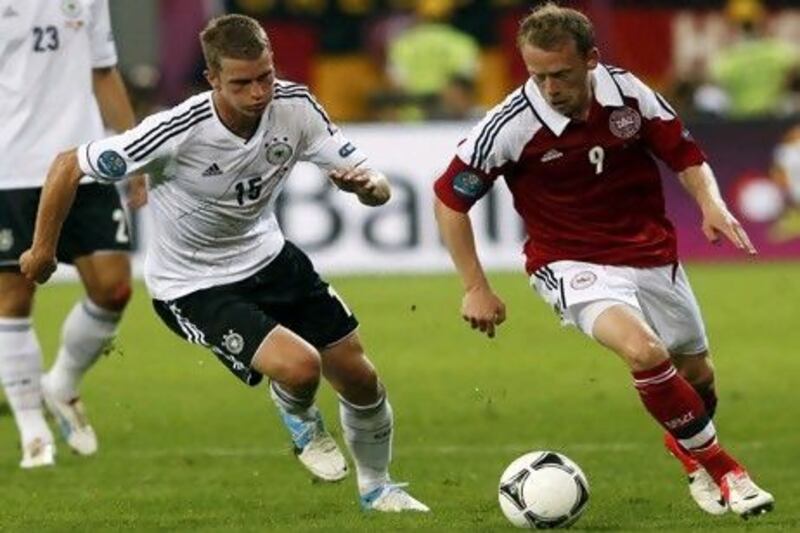 Denmark's Michael Krohn-Dehli, right, challenges Germany's Lars Bender, who replaced the suspended Jerome Boateng in the German line-up and ended up knocking in the winning goal.