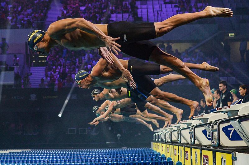 Nathan Adrian, front, dives into the water on the first day of the International Swimming League competition at the Budapest Duna Arena on Saturday, October 26. AP