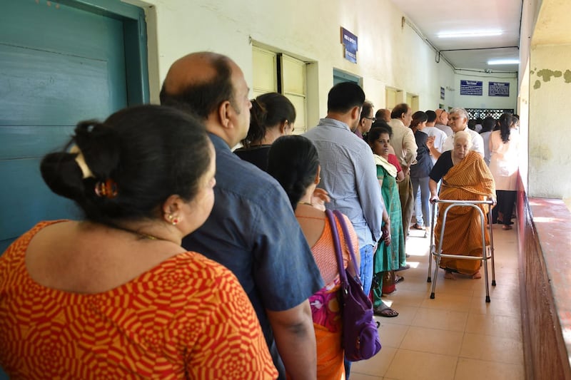 Indian voters line up to cast their ballot in Bengaluru. AFP