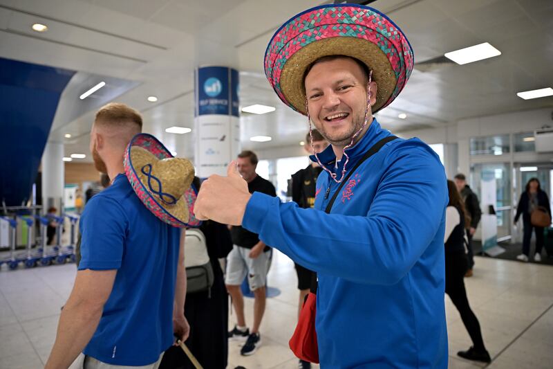 Rangers fans gather at Glasgow airport. Getty