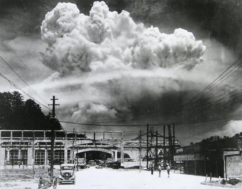 View of the radioactive plume from the bomb dropped on Nagasaki City, as seen from 9.6 km away, in Koyagi-jima, Japan, August 9, 1945. The US B-29 superfortress Bockscar dropped the atomic bomb nicknamed 'Fat Man,' which detonated above the ground, on northern part of Nagasaki City just after 11am. (Photo by Hiromichi Matsuda/Handout from Nagasaki Atomic Bomb Museum/Getty Images)