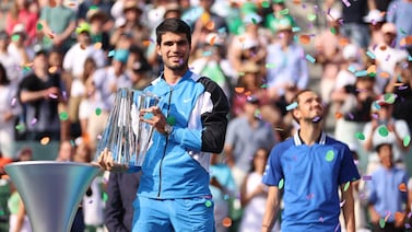Carlos Alcaraz of Spain holds the Indian Wells Masters trophy after defeating Daniil Medvedev in the final. Getty Images