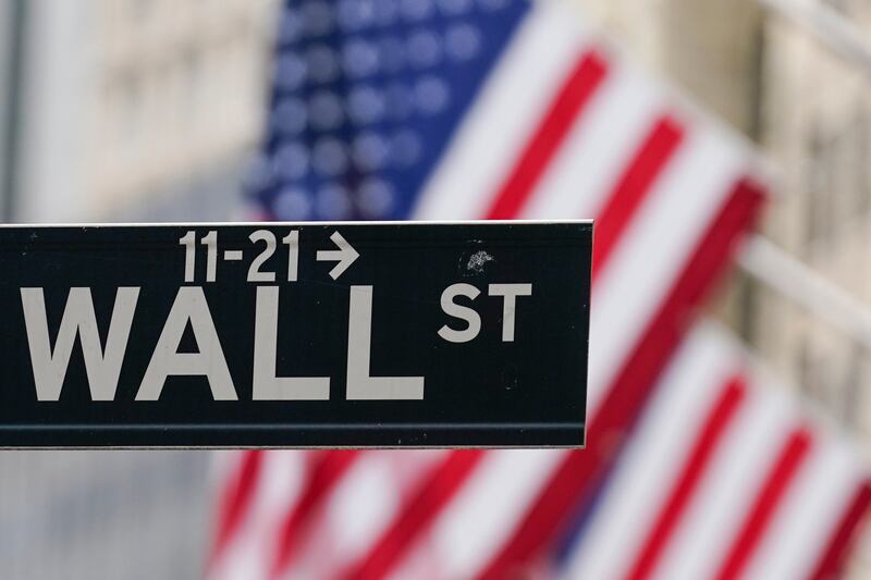 A Wall Street sign in New York. The market regulator has slapped fines on the five biggest US investment banks for record-keeping lapses. AP