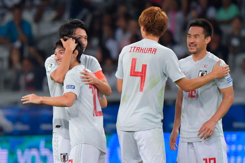 Japan's Shoya Nakajima, second left, celebrates with teammates after scoring against Ecuador. AFP