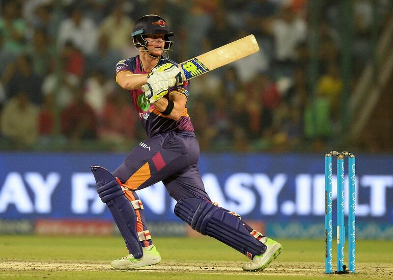 (FILES) In this photograph taken on May 12, 2017, Rising Pune Supergiant batsman and team captain Steve Smith plays a shot during the 2017 Indian Premier League (IPL) Twenty20 cricket match between Delhi Daredevils and Rising Pune Supergiant at The Feroz Shah Kotla Cricket Stadium in New Delhi. 
The Indian Premier League on March 28 banned disgraced Steve Smith and David Warner from playing in this year's tournament after their ball-tampering scandal. Smith and Warner have $1.9 million dollar contracts, Smith with the Rajasthan Royals and Warner for Sunrisers Hyderabad. Cricket Australia has reportedly banned the two from playing for their country for 12 months because of their cheating in the third Test in South Africa.
 / AFP PHOTO / SAJJAD HUSSAIN / ----IMAGE RESTRICTED TO EDITORIAL USE - STRICTLY NO COMMERCIAL USE----- / GETTYOUT