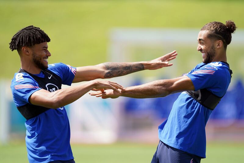 England's Tyrone Mings, left, with Dominic Calvert-Lewin during a training session at St George's Park ahead of the Euro 2020 final against Italy.