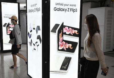 An advertisement for the Samsung Galaxy Z Fold3 and Flip3 smartphones at a shopping area in Seoul. AFP