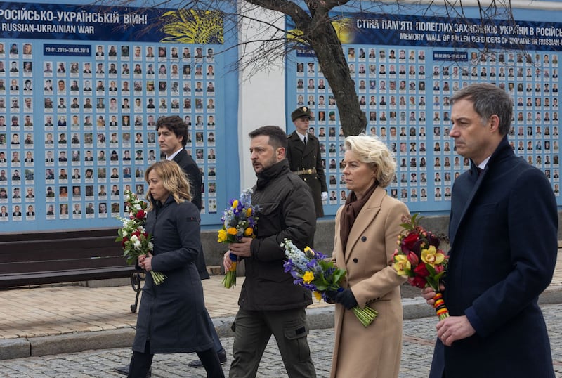 Canada's Prime Minister Justin Trudeau, Italy's Prime Minister Giorgia Meloni, Ukraine's President Volodymyr Zelenskyy, European Commission President Ursula von der Leyen and Belgium's Prime Minister Alexander De Croo attend a wreath-lying ceremony at the Memory Wall of Fallen Defenders of Ukraine in Kyiv. AFP