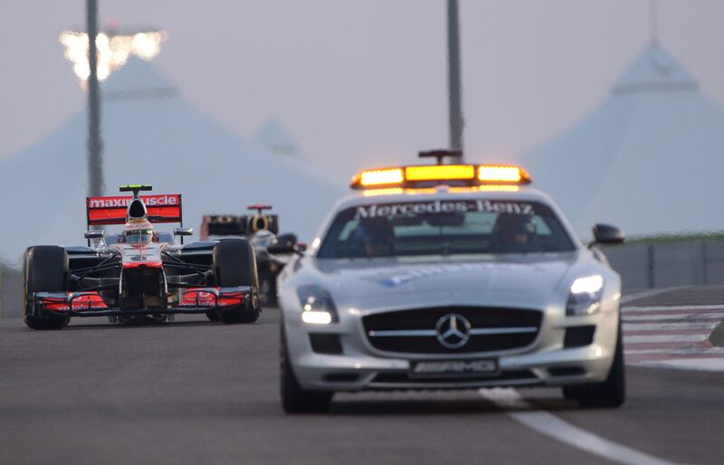 McLaren Mercedes' British driver Lewis Hamilton follows the safety car during at the Yas Marina circuit on November 4, 2012 in Abu Dhabi during the Abu Dhabi Formula One Grand Prix.  AFP PHOTO / TOM GANDOLFINI
 *** Local Caption ***  818466-01-08.jpg