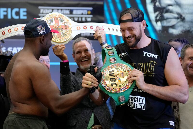 British heavyweight boxers Tyson Fury and Dillian Whyte pose as they take part in their weigh-in at Boxpark Wembley. AP