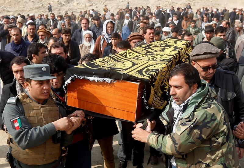 Afghan men carry the coffin of one of the victims of yesterday's car bomb attack in Kabul, Afghanistan January 28, 2018. REUTERS/Omar Sobhani     TPX IMAGES OF THE DAY