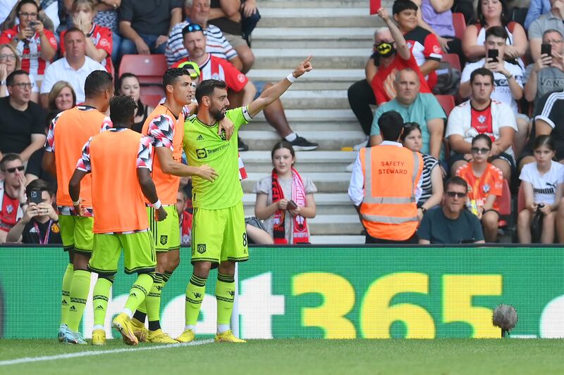 Bruno Fernandes celebrates with Cristiano Ronaldo after scoring at St Mary's Stadium. Getty